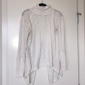Free People cream turtle neck with back slit